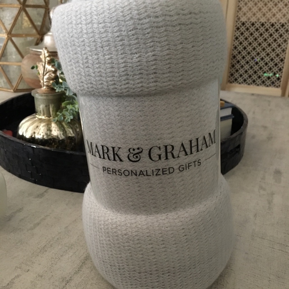 Light gray fringed throw blanket